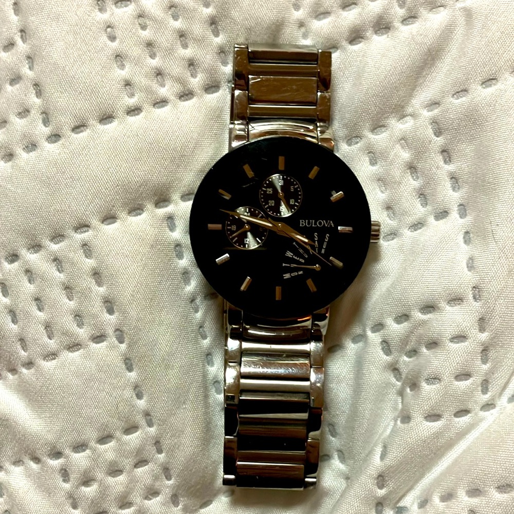 Movado watch black face, silver steel band
